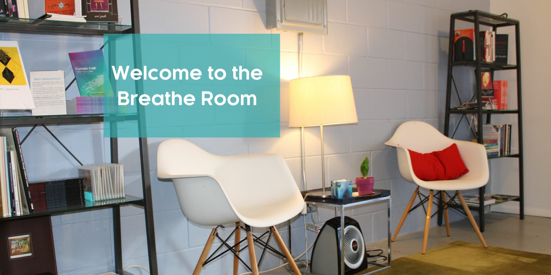 Texts reads "Welcome to the breathe room" in the background are bookshelves, two chairs, and a lamp
