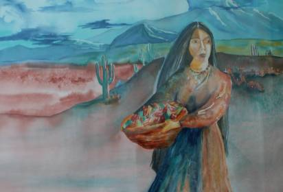 A woman with long dark hair holds a basket of colorful items, standing in a desert landscape with cacti and mountains in the background.